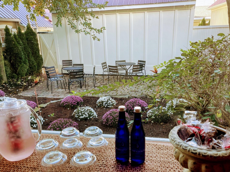Table with bottles of water in garden