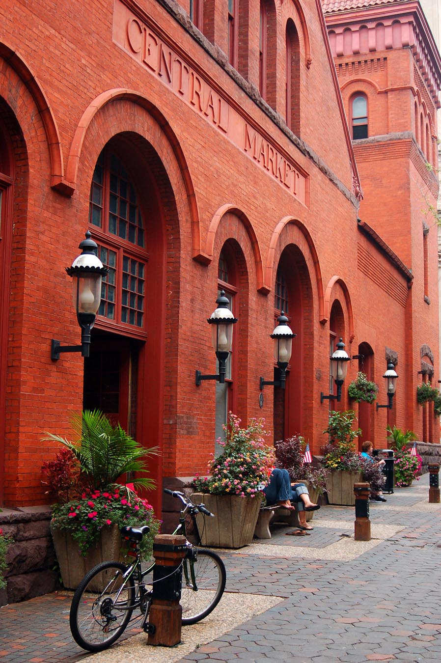 Red building with bike parked in front