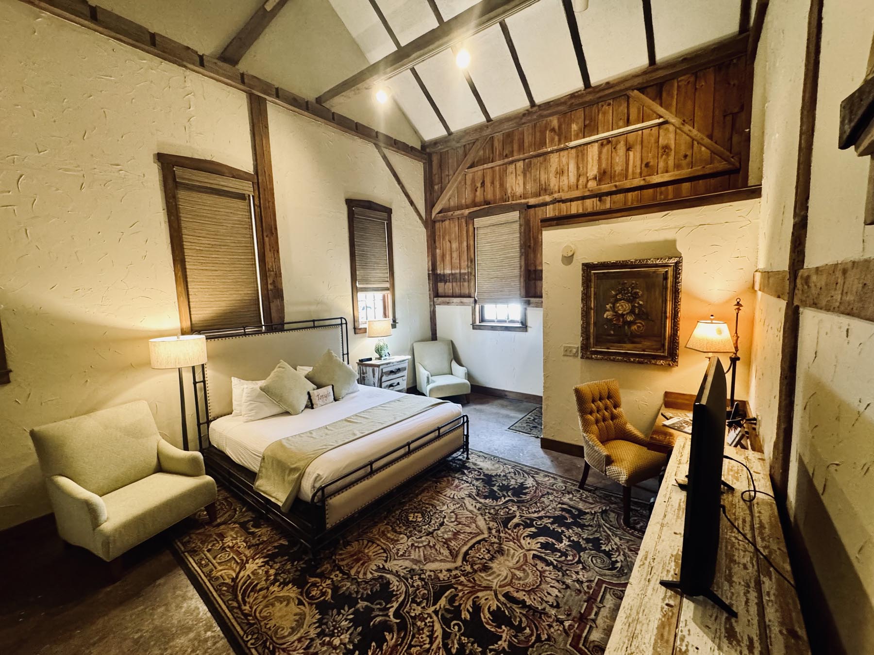 room with bed and exposed beams