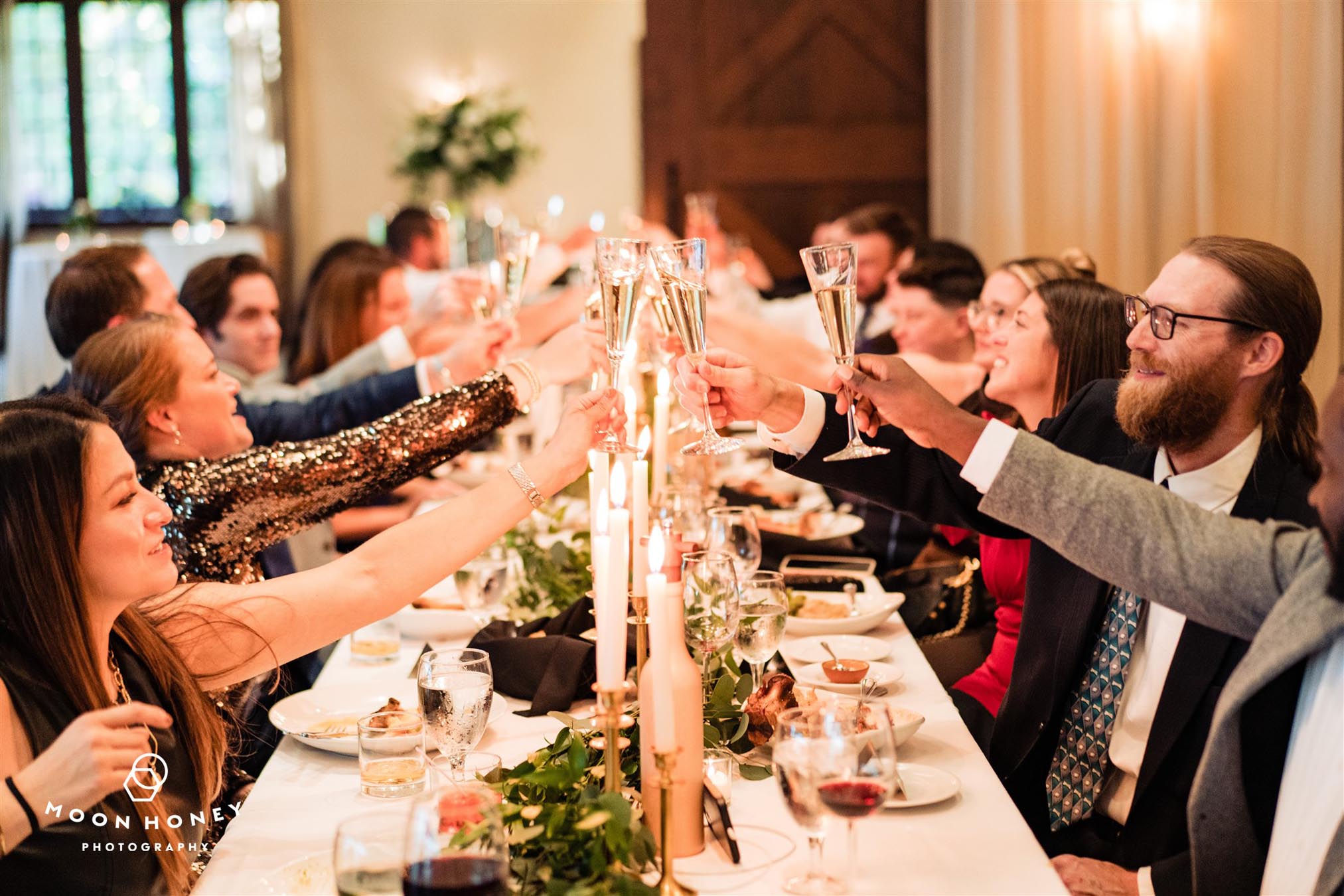 Guests toasting at wedding